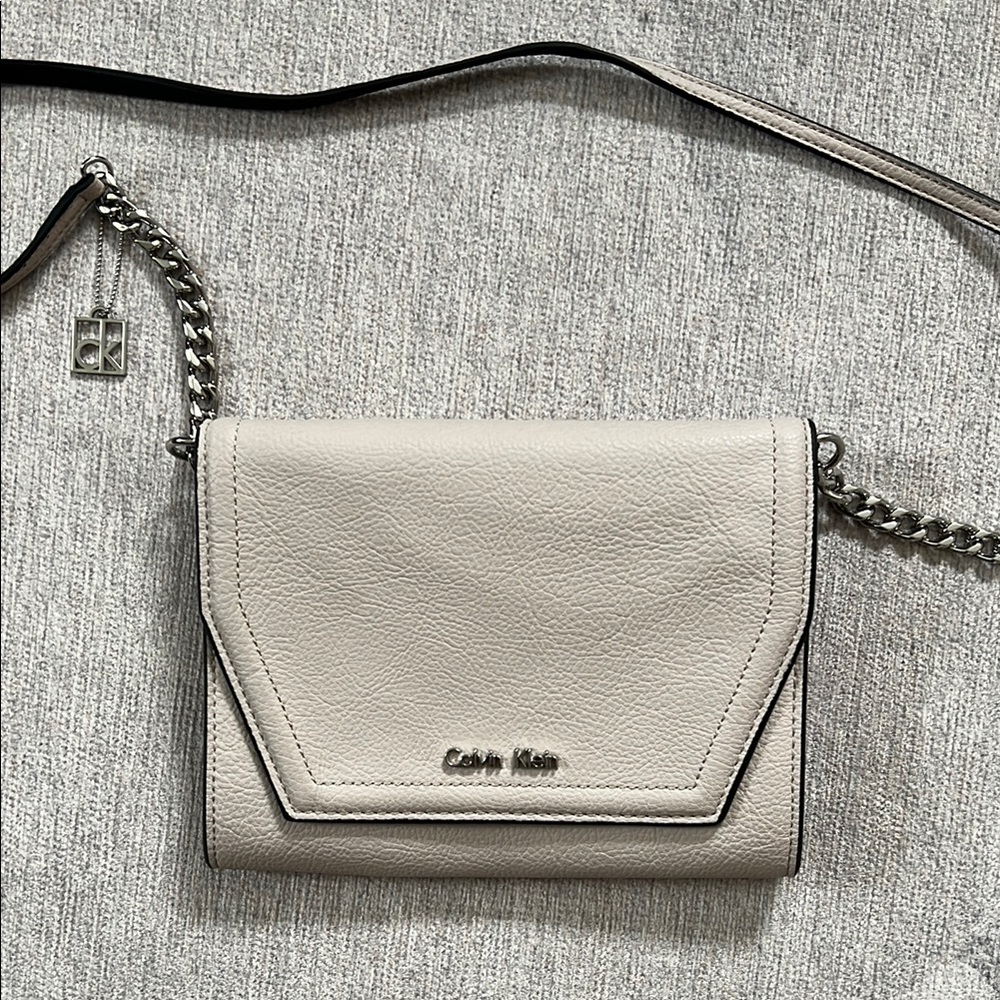 Calvin Klein Cream Crossbody Bag with Flap Closure and Silver Chain Strap